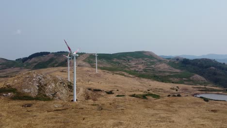 drone-filming-wind-turbines-above-the-hills
