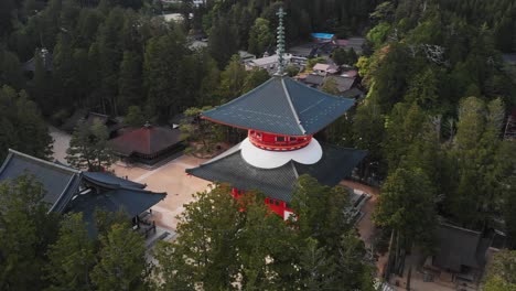 Aerial-Drone-Fly-Mount-Koya-Temple-settlement-in-Wakayama-Japan-Trees-Landscape-Establishing-shot-of-Japanese-travel-attraction,-Koyasan