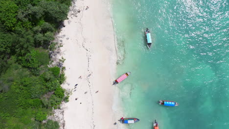 Above-view-of-sandy-beach-and-clear-green-water-in-Nemba-beach-at-Zanzibar