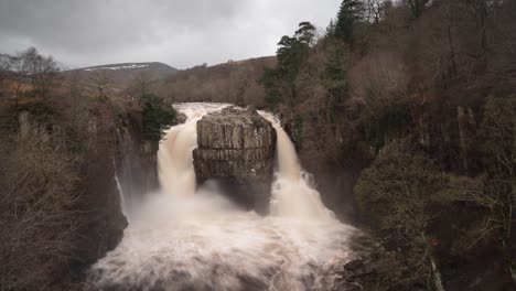 A-timelapse-of-High-Force-Waterfall,-Upper-Teesdale-in-winter-under-heavy-flow-after-a-winter-storm