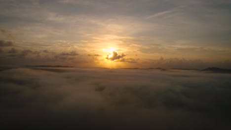 Right-to-left-aerial-view-of-the-sunrise-about-low-cloud