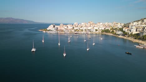 Cinematic-Establishing-Shot-of-Boats-Anchored-in-Saranda-Bay,-Albania