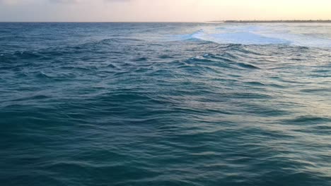 Drone-shots-of-sea-waves-accompanied-by-a-nice-sunset