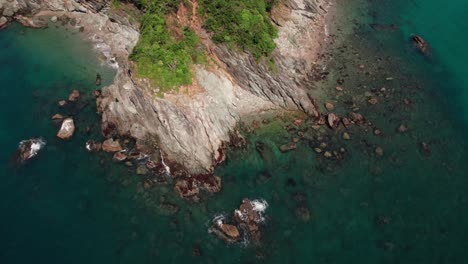 Slow-motion-aerial-drone-tops-down-Japanese-beach-island-at-Wakayama-blue-Sea,-Pacific-ocean,-natural-environment-of-Japan,-panoramic-landscape