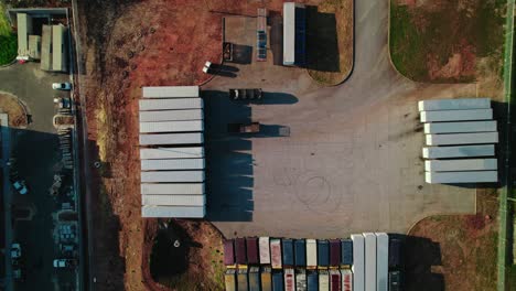 Top-down-aerial-of-parking-lot-of-semi-trailers-in-South-Atlana,-Georgia