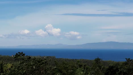 Aerial-view-of-Siquijor-Island-framed-by-the-swaying-foliage,-famous-summer-travel-destination-in-the-Philippines