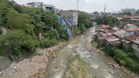 Flowing-Cisadane-River-As-Drone-Curves-Its-Way-Downstream-In-Bogor-West-Java
