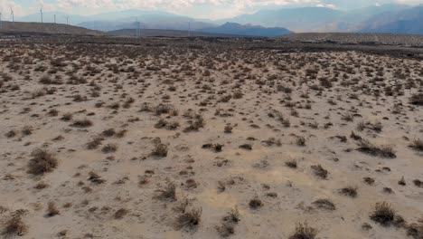 Slow-pan-down-over-desert-sand-in-small-town-near-Palm-Springs,-CA