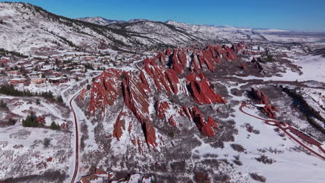 March-winter-morning-after-snowfall-stunning-Roxborough-State-Park-Colorado-aerial-drone-landscape-sharp-jagged-dramatic-red-rock-formations-Denver-foothills-front-range-hike-blue-sky-back-movement
