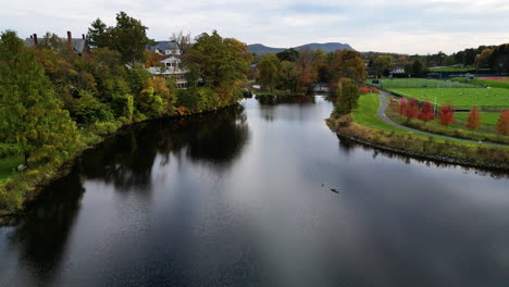 Paradise-Pond-at-Smith-college-in-the-Spring,-aerial-establishing