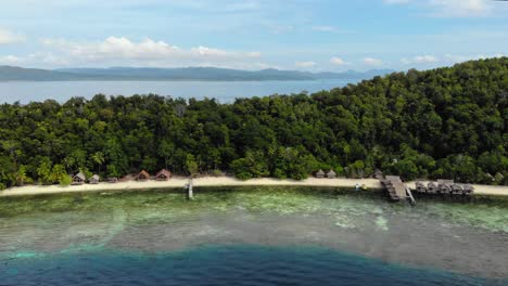 Aerial-orbit-shot-showcases-the-breathtaking-beauty-of-Kri-Island-in-the-Raja-Ampat-archipelago,-Indonesia