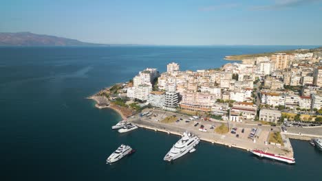 Orbiting-Aerial-View-Above-Port-of-Saranda-with-Yachts-Docked-for-the-Day