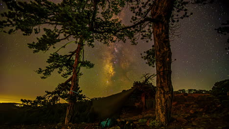 The-stars-of-the-Milky-Way-galaxy-move-above-the-mountain-hills---Night-to-morning---Hammock-camping-under-the-starry-night-sky