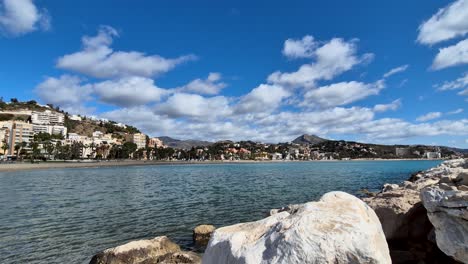 View-Over-La-Malagueta-Beach-on-a-Sunny-Day-With-Fast-Moving-Clouds,-Spain