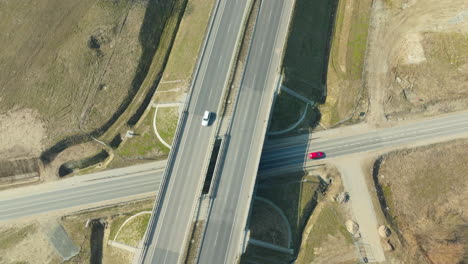 aerial-view-of-a-highway-overpass-with-cars-in-motion