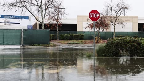 severe-flooding-at-a-stop-sign-during-the-rain-and-flooded-road-in-San-Bernardino-california-60fps