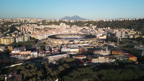 Forward-Drone-Shot-Reveals-Stadio-Diego-Armando-Maradona,-Mount-Vesuvius-in-Background
