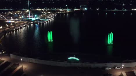 Establishing-Shots-Colorful-fountain-show-is-happening-at-New-Atal-lake-in-Rajkot-with-lots-of-people-watching-and-laser-show-is-also-happening