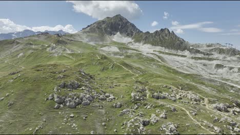 Aerial-forward-shot-drone-shot-of-mountains-in-French-Alps,-Les-Arcs,-France-during-summer