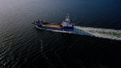 Landing-Craft-Leaving-Wake-In-The-Calm-Sea-In-Tasmania,-Australia