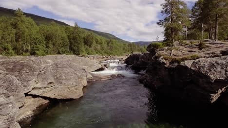 Aerial-of-a-small-river-with-rapids-and-pools-in-northern-Norway