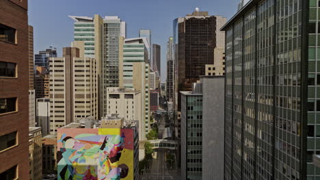 Calgary-AB-Canada-Aerial-v33-perspective-leading-line-drone-flyover-Downtown-Commercial-above-7-Ave-SW-light-rail-street-capturing-dense-skyscrapers-cityscape---Shot-with-Mavic-3-Pro-Cine---July-2023