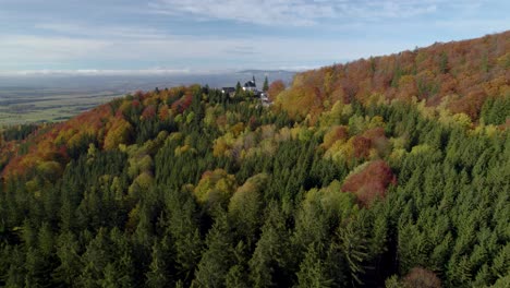 Aerial-establishing-shot-of-the-Sanctuary-of-Mary-of-the-Snow-in-Sudety-Mountains,-Poland