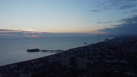 Aerial-panoramic-sunset-landscape-at-coastline-town-Brighton-East-Sussex-sea-water-skyline-dock-in-contrasted-dusk