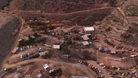 Aerial-View-of-Jerome-Ghost-Town,-Arizona-USA,-Tourist-Attraction,-Rustic-Buildings-and-Old-Vehicles