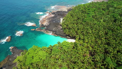 Aerial-tilt-shot-revealing-the-Bateria-beach-on-Rolas-island-in-Sao-Tome,-Africa