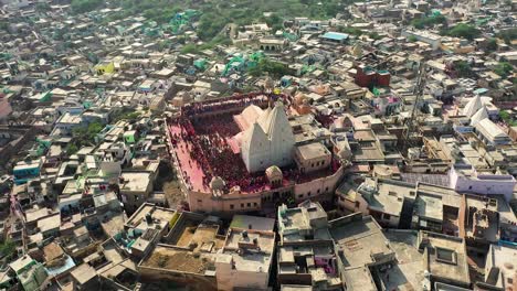 AERIAL-DRONE-VIEW-Don-is-moving-towards-the-camera-side-where-there-are-lots-of-people-playing-with-colors-and-lots-of-people-flying-colors-from-above