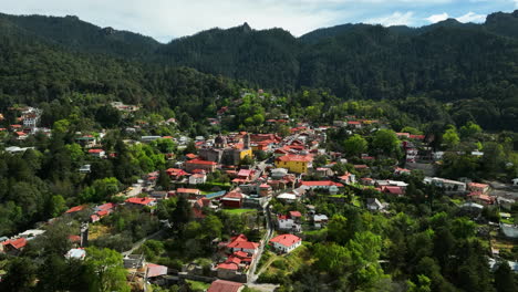 Drone-circling-the-Mineral-del-Chico-magic-town,-sunny-day-in-Hidalgo,-Mexico