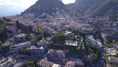 Aerial-establishing-shot-of-the-north-side-of-the-famous-Taormina,-Sicily,-Italy