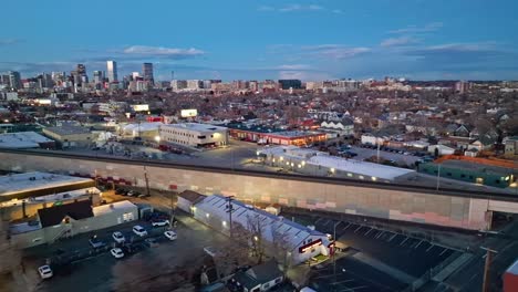 Panormaic-aerial-overivew-at-dusk-with-glow-of-lights-in-Denver's-industrial-district