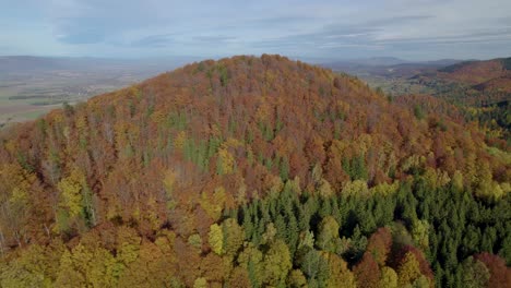 Aerial-establishing-shot-of-the-autumn-colored-mountains-in-Europe