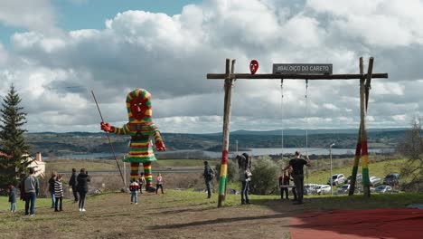 Careto-Effigy-Overlooking-Scenic-Landscape-with-tourists-around,-Podence-Portugal