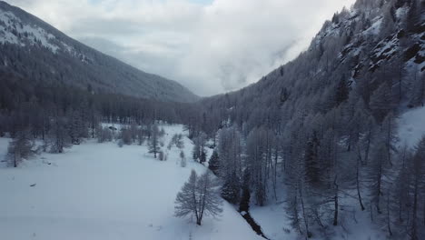 Aerial-drone-view-of-picturesque-frozen-mountainous-landscape-in-wintertime