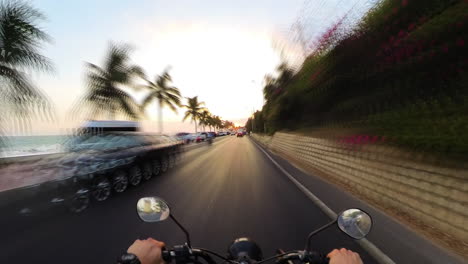Motorbike-Riding-At-Sunset-Along-The-Palm-Tree-Lined-Beaches-Of-Mui-Ne,-Vietnam