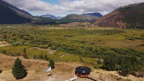 Scenic-Fields-And-Mountains-In-El-Hoyo-Village-In-Argentina---Aerial-Drone-Shot