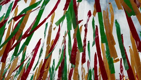 Colorful-Ribbons-Blowing-in-the-Wind-at-Podence-Carnival,-Portugal