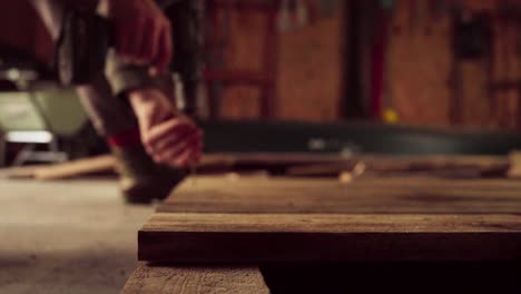 Person-Using-Cordless-Screw-Driver-On-Woodwork-Carpentry-Inside-The-Shop