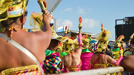 Performers-raise-ceremonial-spears-during-Carnaval-parade-party