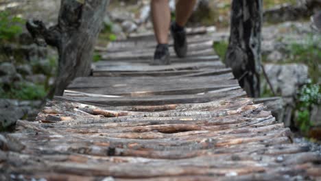 A-wooden-bridge-is-crossed-while-hiking