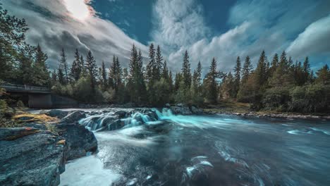 Dark-stormy-clouds-whirl-above-the-rapids-on-the-fast-flowing-river
