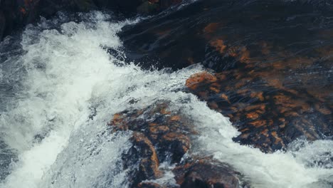 Whitewater-cascades-over-the-dark-chipped-rocks