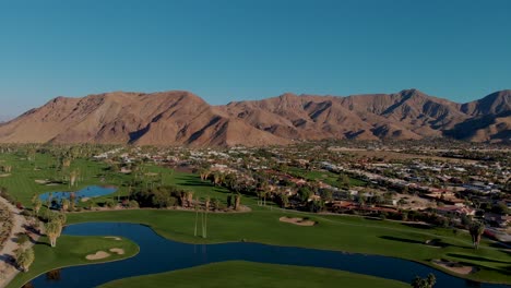 Flying-over-golf-course-and-palm-springs-neighborhood