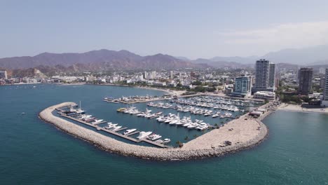 Marina-in-the-Caribbean-sea,-Port-of-Santa-Marta-in-Colombia,-aerial-orbiting