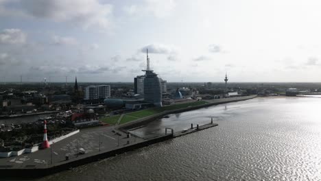 big-tower-and-buildings-on-the-coast-of-a-city,-Bremerhaven,-germany,-europe,-drone,-north-sea
