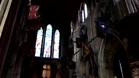 Interior-view-of-St-Patrick's-Cathedral-with-stained-glass,-arcades-and-flags