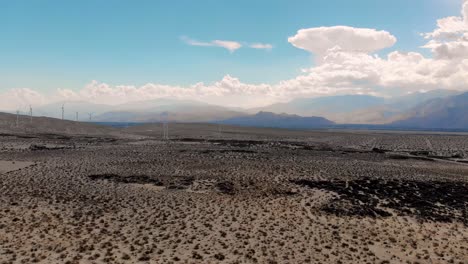 Slow-push-up-over-desert-windmills-and-mountains-drone-near-Palm-Springs